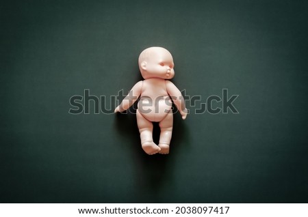 Ghost baby turn head to the right on dark background. Scary halloween concept.