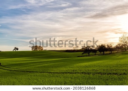 sunset over fields in beautiful landscape in the rural countryside of Baden-Württemberg Germany