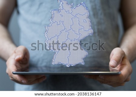 A person presenting a 3D render of the map of Germany