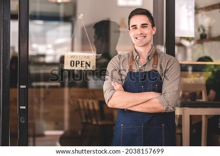 The coffee shop is open and male baristas are happy to serve you.