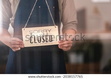 A male employee posted a sign saying the store was closed.