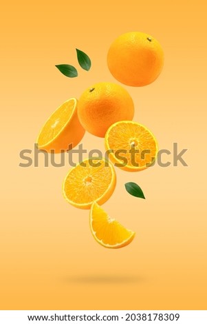 Stack of Orange falling or flying.Creative levitation food on orange color background with vertical frame Royalty-Free Stock Photo #2038178309