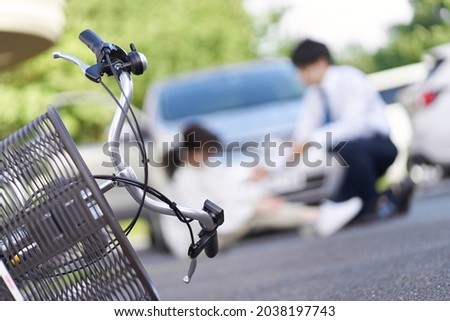 Bicycle and car traffic accident Royalty-Free Stock Photo #2038197743