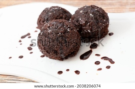 Chocolate muffins with coconut flakes. 