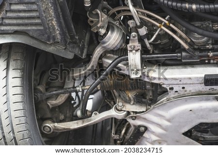 Close-up of automotive front suspension parts. Royalty-Free Stock Photo #2038234715