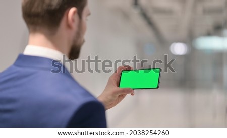 Businessman Watching Smartphone with Green Screen 