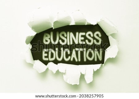 Conceptual caption Business Education. Conceptual photo acquiring knowledge on fundamentals of business practices Tear on sheet reveals background behind the front side