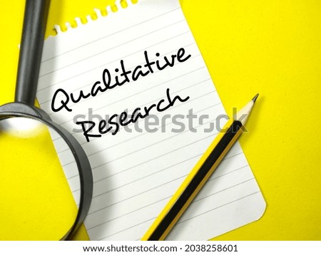 Business concept.Text Qualitative Research writing on notepaper with pencil and magnifying glass on yellow background. Royalty-Free Stock Photo #2038258601
