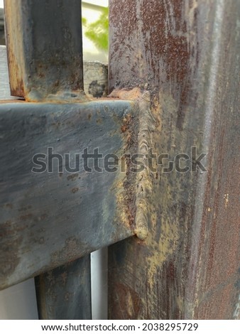 Old Rusty Metal Pole and Fall Paint Color.