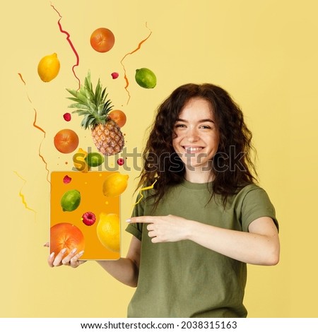 Shopping online. Contemporary art collage smiling caucasian woman doing online grocery shopping isolated over yellow background. Fruits, lemons, pineaple appearing from tablet screen. Buying from home