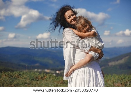Grandmother and daughter and mountain views