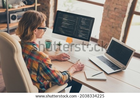 Profile side photo of young man programmer type laptop coder cyber space testing office desk indoors Royalty-Free Stock Photo #2038334225