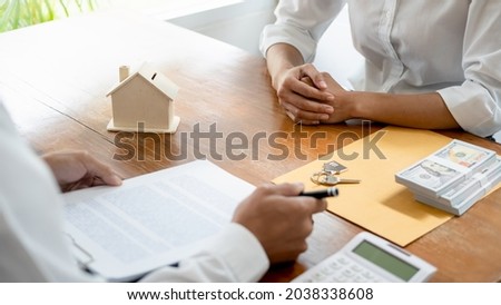 Real estate agent and customer signing contract to buy house, insurance or loan real estate.