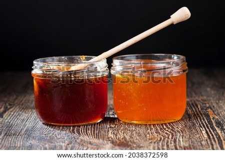dipped in honey specially made from wood homemade coarse spoon, sweet bee honey and one wooden spoon that allows you to transfer and pour honey without dripping and spreading