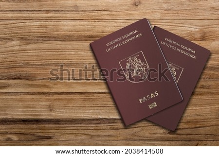 Lithuanian Passport on Wood Lines Background Banner with Copy Space