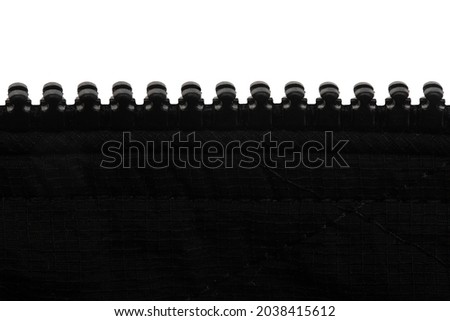 zipper made of black plastic with a green lock, isolate on a white background
