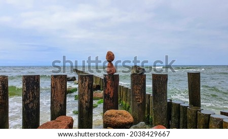 The Baltic Sea. A beach with breakwaters. Sea stones. Sandy beach.