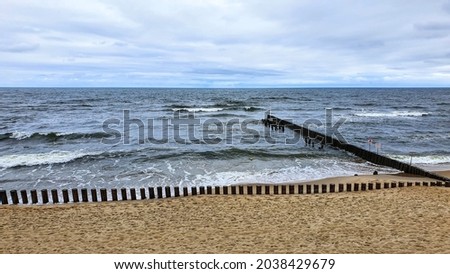 The Baltic Sea. A beach with breakwaters. Sea stones. Sandy beach.