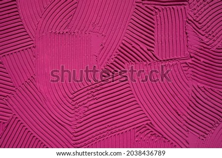 Relief pattern of decorative plaster with a pronounced structure of pink color