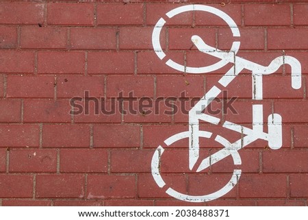 Cycle path pedestrian warning sign. Sidewalk markings. Dedicated lane for cyclists in the pedestrian zone of the urban environment. Background with copy space
