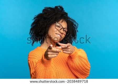 You what we need: excited african woman choosing you and gesturing point fingers front. Happy black female directing to camera, wink and bite lip. Career development, job offer and join team concept Royalty-Free Stock Photo #2038489718