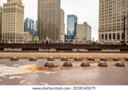 Closeup of rusting bolts on the beautiful, iconic red bridges over the Chicago River, downtown in the Loop.