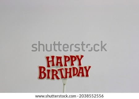 happy birthday topper on white paper background. isolated with space for text 