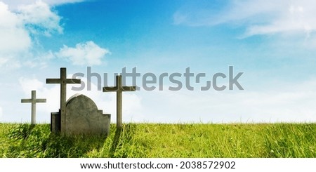 Image of cemetery with cross symbol of tombstone under blue sky