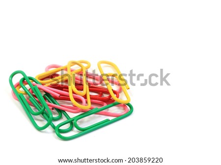 Bunch of colorful paper clips isolated on a white background closeup