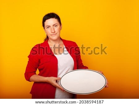 a woman in a classic red suit with a sign for writing text in her hands. Business concept