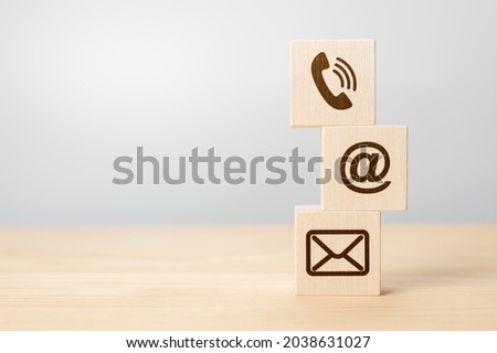 Contact us concept, Wood block symbol telephone, mail, and address on desk. Close-up Of Various Contact Options on wooden cubes. Wood block symbol telephone, mail, and address on desk. copy space