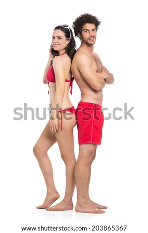 Happy Couple In Red Swimwear Standing Isolated On White Background