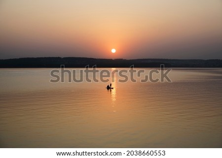 Active paddle boarders. Black sunset silhouette of daughter and father paddling on stand up paddleboard. Healthy lifestyle. Water sport, SUP surfing tour in adventure camp on family summer beach.
