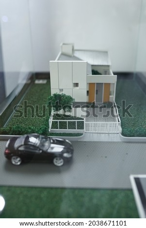 Miniature buildings and cars. A mockup is a miniature or model of a building that will be made, to facilitate the visualization of the design results. In the form of structural design, and interior.