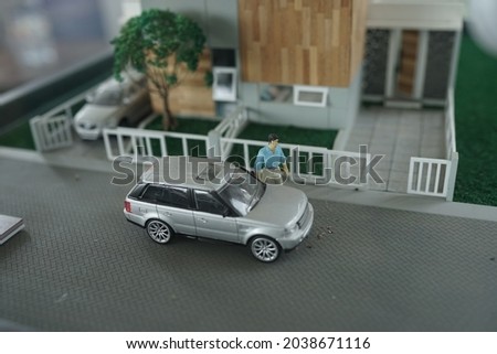 Miniature buildings and cars. A mockup is a miniature or model of a building that will be made, to facilitate the visualization of the design results. In the form of structural design, and interior.