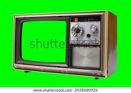 Old vintage 1970s TV with green screen for adding video isolated on green background.Vintage TVs 1960s 1970s 1980s 1990s 2000s. 