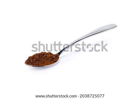 Instant coffee powder in stainless teaspoon isolated on white background. Clipping path. Royalty-Free Stock Photo #2038725077