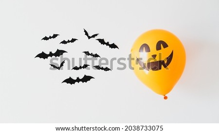 Halloween bats and ghost balloon on white background. Happy Halloween holiday concept.