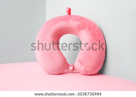 Travel pillow on color background Royalty-Free Stock Photo #2038736984