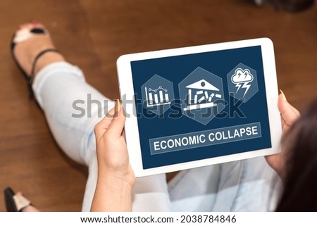 Tablet screen displaying an economic collapse concept