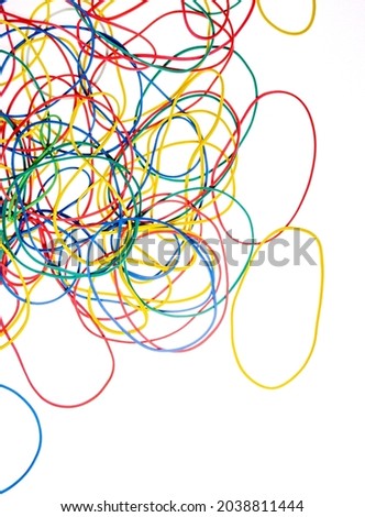 Colorful rubber bands close up on white background