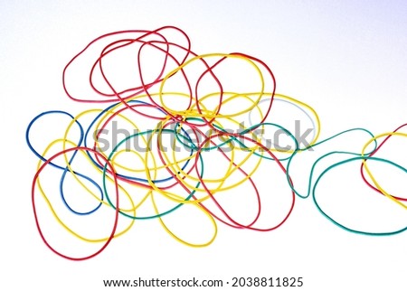 Colorful rubber bands close up on white background