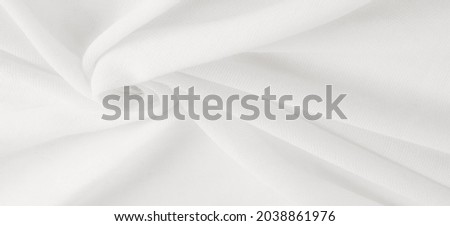 White cloth. abstract background of luxury fabric or liquid silk texture of waves or wavy folds. background or elegant wallpaper design. Cotton texture, natural fabric and dye