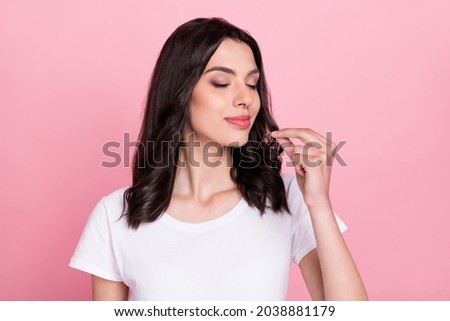 Photo of charming young happy calm woman make fingers chef sign tasty isolated on pink color background