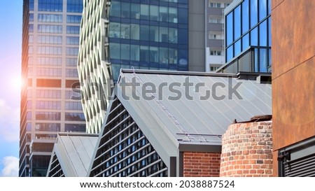 Fragment of glass and metal facade walls. Commercial office buildings. Abstract modern business architecture.