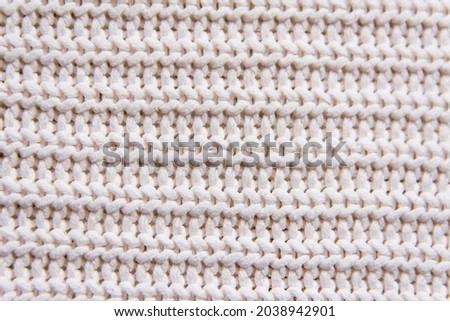 horizontal striped beige knit fabric texture, knitted pattern background