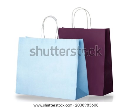 Light blue and dark purple paper shopping bags isolated on white background