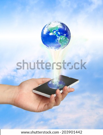 Touch screen mobile phone and a glowing earth globe, Elements of this image furnished by NASA