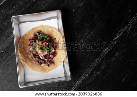 DELICIOUS CARNITAS TACO FLAT LAY OF MEXICAN FOOD OVER A WOODEN BACKGROUND MEAL DIRECTLY FROM ABOVE