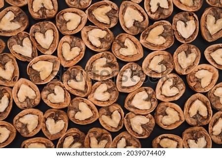 Walnuts. Background of fresh walnuts.  Abstract walnuts heap pattern background. Natural food in-shell nuts. Natural walnut background pattern texture.
